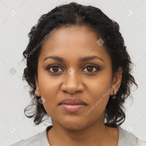 Joyful black young-adult female with long  brown hair and brown eyes