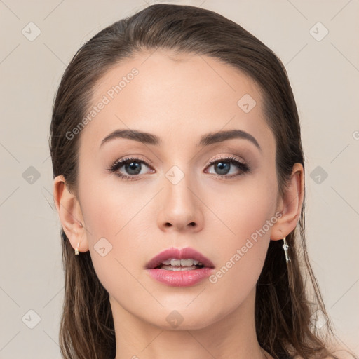 Neutral white young-adult female with long  brown hair and brown eyes