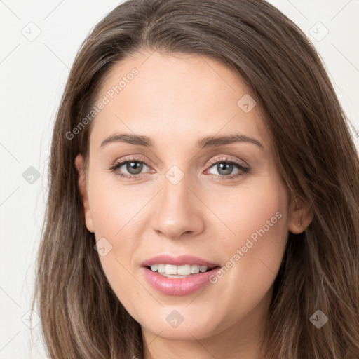 Joyful white young-adult female with long  brown hair and grey eyes