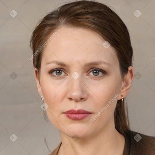 Joyful white young-adult female with medium  brown hair and grey eyes