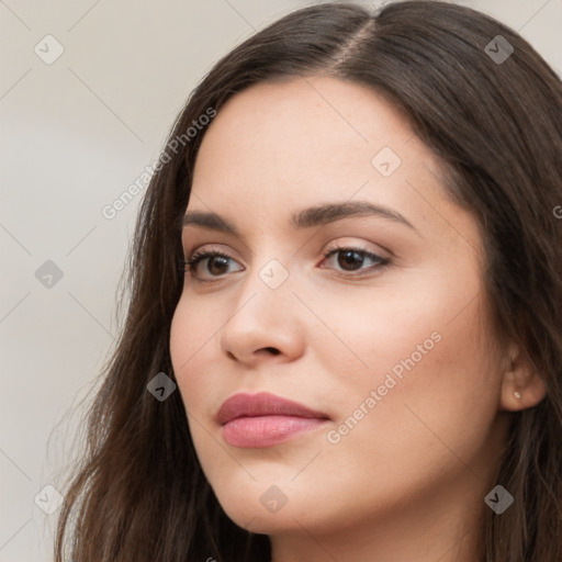 Neutral white young-adult female with long  brown hair and brown eyes