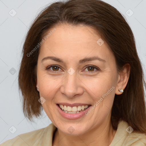 Joyful white adult female with medium  brown hair and brown eyes