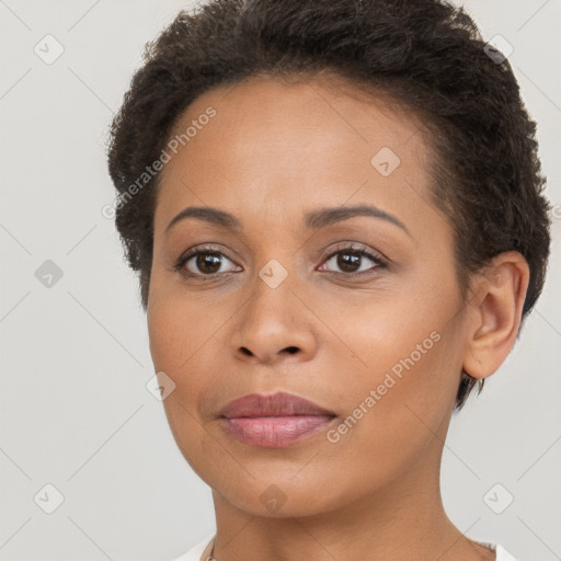 Joyful latino young-adult female with short  brown hair and brown eyes