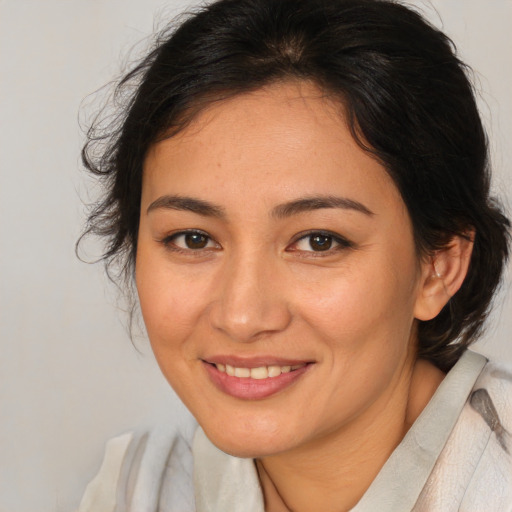 Joyful white young-adult female with medium  brown hair and brown eyes
