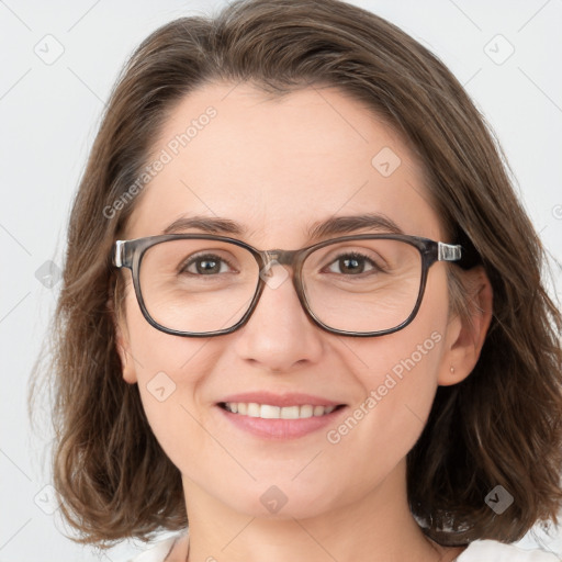 Joyful white adult female with medium  brown hair and brown eyes