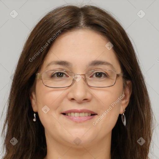 Joyful white adult female with long  brown hair and brown eyes