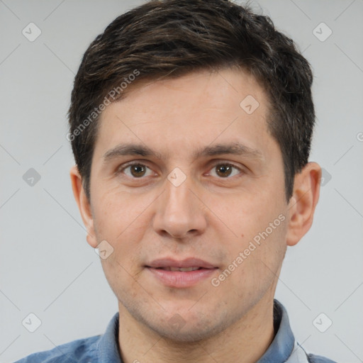 Joyful white adult male with short  brown hair and brown eyes