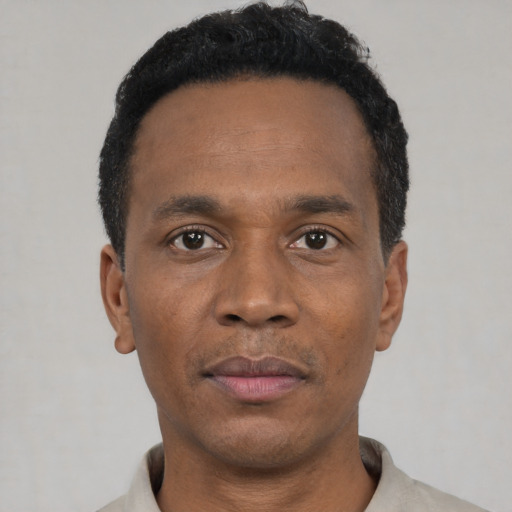 Neutral black young-adult male with short  black hair and brown eyes