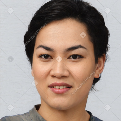 Joyful asian young-adult female with medium  black hair and brown eyes