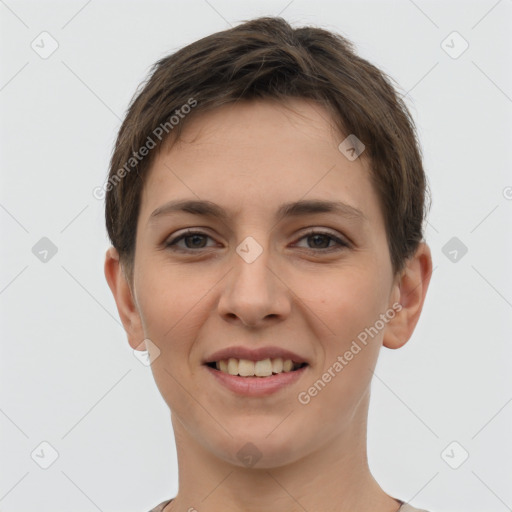 Joyful white young-adult female with short  brown hair and grey eyes