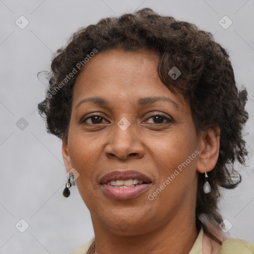 Joyful black adult female with short  brown hair and brown eyes