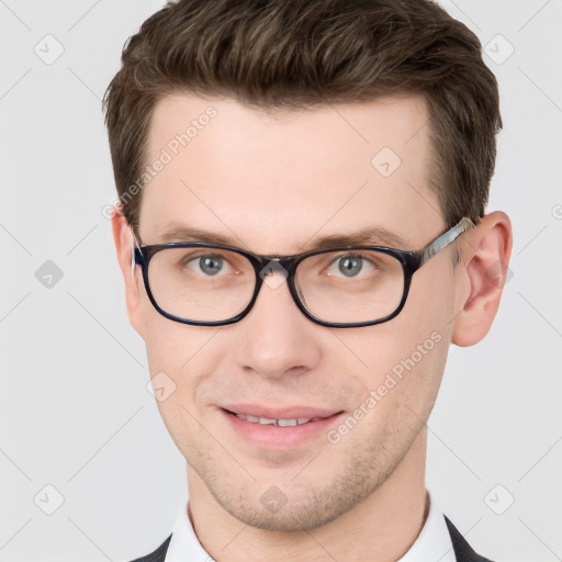 Joyful white adult male with short  brown hair and grey eyes