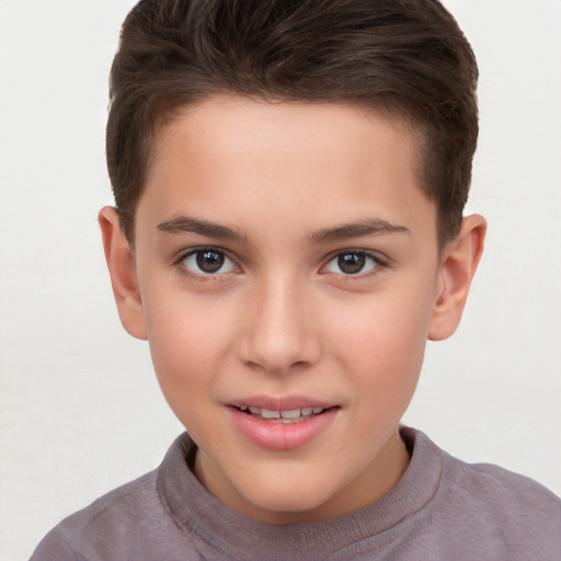 Joyful white child male with short  brown hair and brown eyes