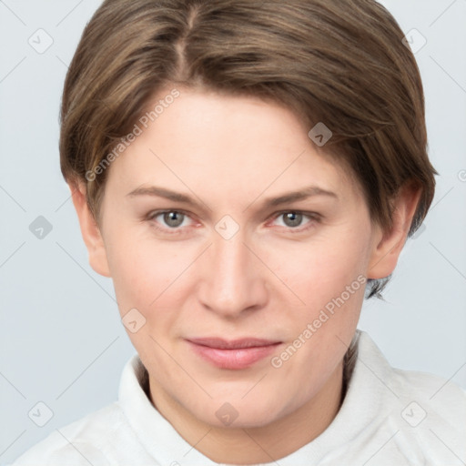 Joyful white young-adult female with short  brown hair and grey eyes