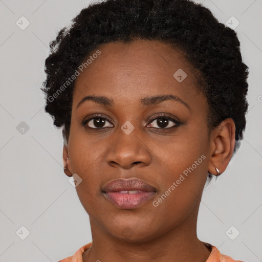 Joyful black young-adult female with short  black hair and brown eyes