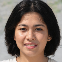 Joyful white young-adult female with medium  black hair and brown eyes