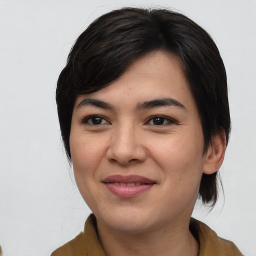 Joyful asian young-adult female with medium  black hair and brown eyes