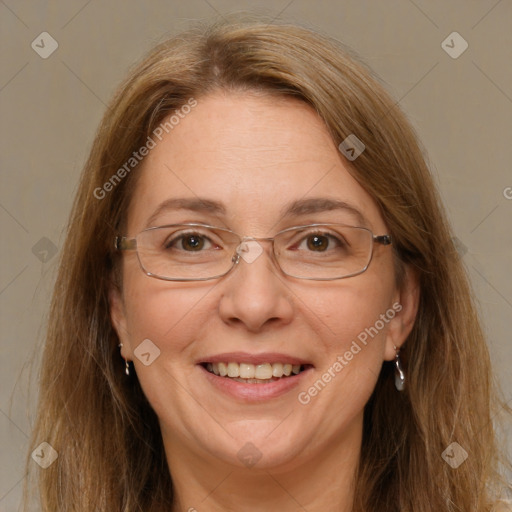 Joyful white adult female with long  brown hair and grey eyes