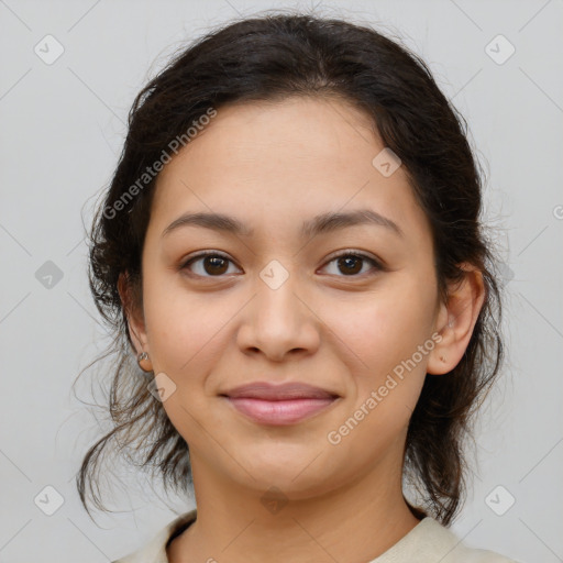 Joyful latino young-adult female with medium  brown hair and brown eyes