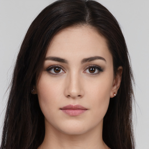 Neutral white young-adult female with long  brown hair and brown eyes