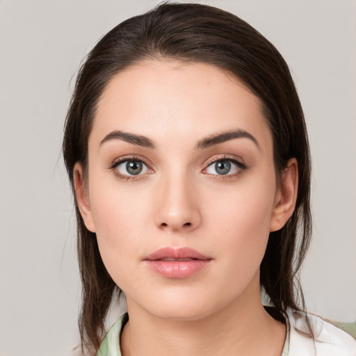 Neutral white young-adult female with medium  brown hair and brown eyes