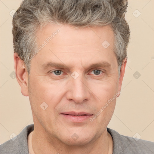 Joyful white adult male with short  brown hair and grey eyes