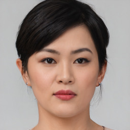 Neutral asian young-adult female with medium  black hair and brown eyes