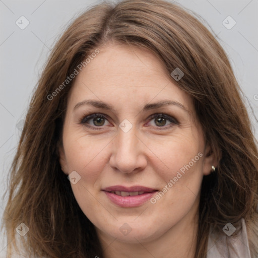 Joyful white adult female with long  brown hair and grey eyes