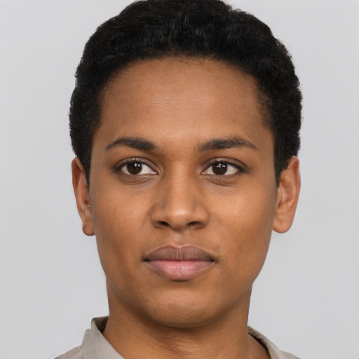 Joyful black young-adult male with short  black hair and brown eyes