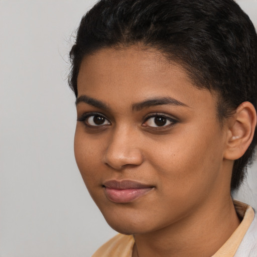 Joyful latino young-adult female with short  brown hair and brown eyes