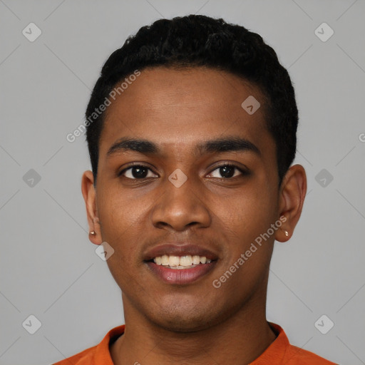 Joyful black young-adult male with short  black hair and brown eyes