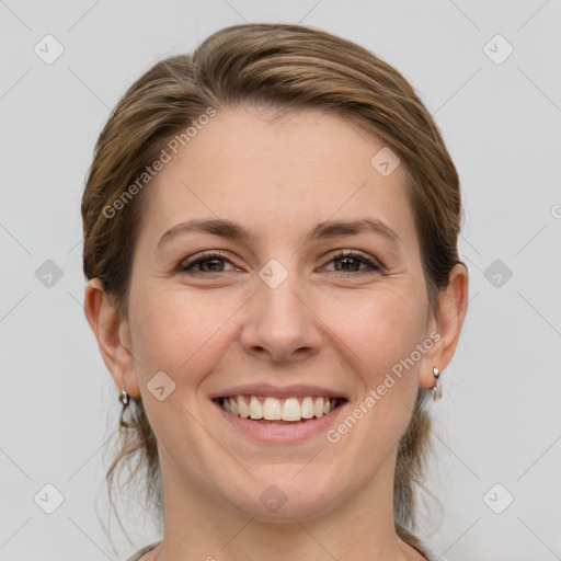 Joyful white young-adult female with medium  brown hair and grey eyes