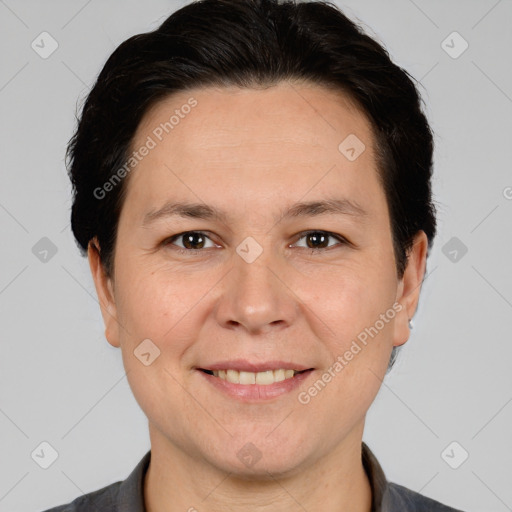 Joyful white adult female with short  brown hair and brown eyes