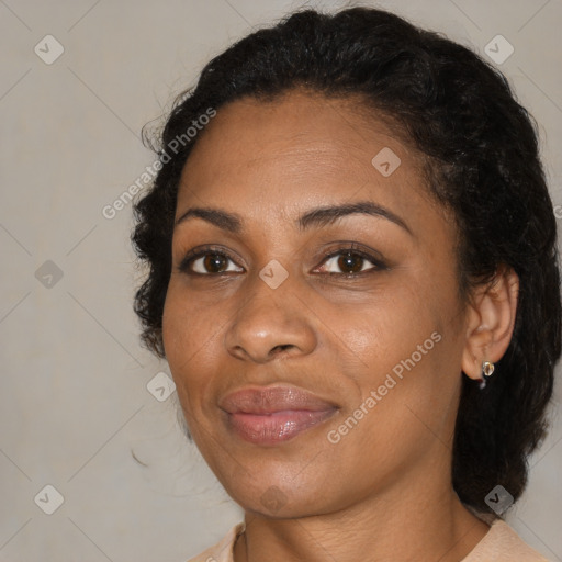 Joyful black young-adult female with medium  brown hair and brown eyes