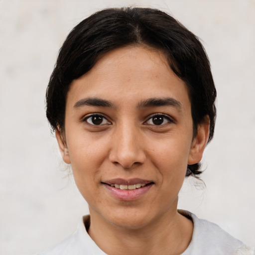 Joyful asian young-adult female with short  black hair and brown eyes
