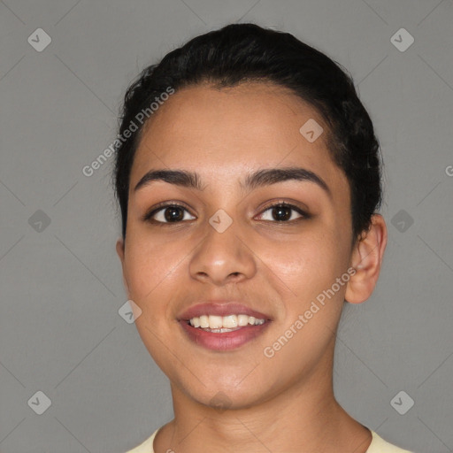 Joyful latino young-adult female with short  black hair and brown eyes