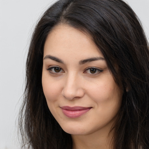 Joyful latino young-adult female with long  brown hair and brown eyes
