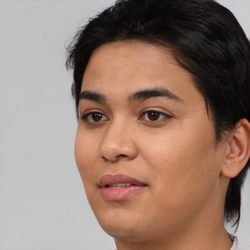 Joyful asian young-adult female with medium  black hair and brown eyes