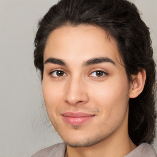 Joyful white young-adult male with medium  brown hair and brown eyes