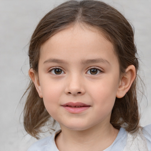 Joyful white child female with medium  brown hair and brown eyes