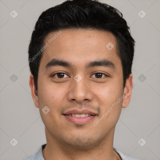 Joyful latino young-adult male with short  black hair and brown eyes