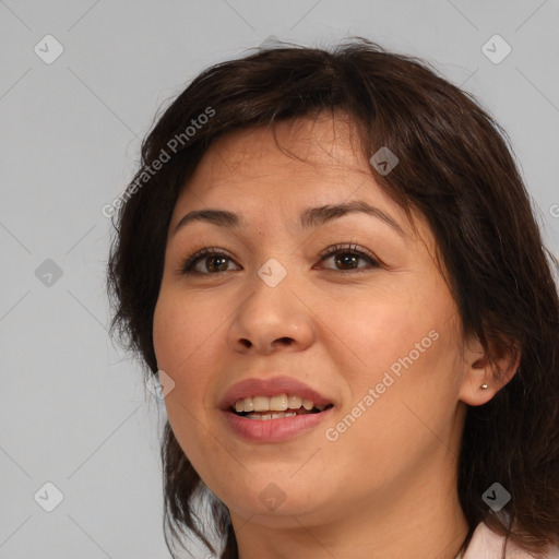 Joyful white adult female with medium  brown hair and brown eyes