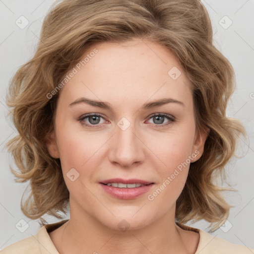 Joyful white young-adult female with medium  brown hair and blue eyes