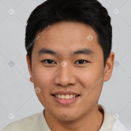 Joyful asian young-adult male with short  black hair and brown eyes