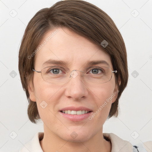 Joyful white adult female with medium  brown hair and grey eyes