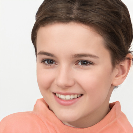 Joyful white child female with short  brown hair and brown eyes