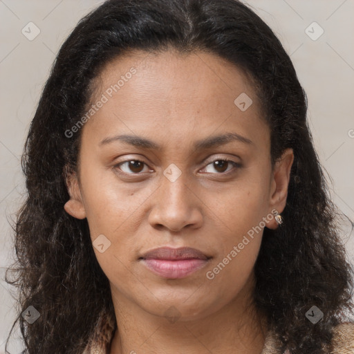 Joyful black young-adult female with long  brown hair and brown eyes