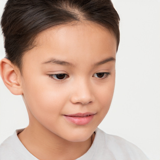 Joyful white child female with short  brown hair and brown eyes