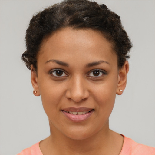 Joyful latino young-adult female with short  brown hair and brown eyes