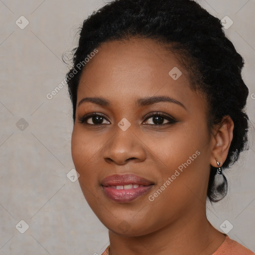 Joyful black young-adult female with medium  black hair and brown eyes